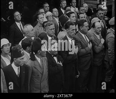 Mourners at the funeral of Anton Cermak, the Mayor of Chicago, 1933. USA. 'When the president-elect [FDR] was visiting Miami, Florida, there in the darkness, someone took a shot at him. The culprit was marched off, but though he'd missed his aim, he'd found a target. Miami's Mayor Cermak. So in place of Franklin Roosevelt, Mayor Cermak lost his life. It is reported that before he died, one of the last things he said was: &quot;I'm glad that it was me&quot;.' Cermak's was the most magnificent funeral procession in the history of Chicago, nearly 150,000 attended his interment. From &quot;Time To Stock Photo