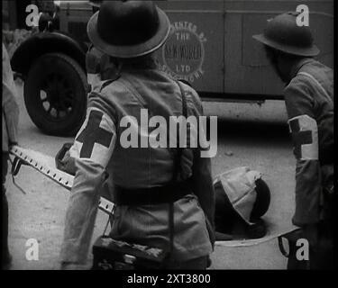 Four Chinese Red Cross Society of China Staff Carrying a Stretcher Supporting an Injured Man Past a Lorry With 'PRESENTED BY the NEW WORLD LTD SINGAPORE' on the Door in a Shanghai Street, 1938. From &quot;Time To Remember -  Wind up Week&quot;, 1938 (Reel 1); documentary film about 1938 - people become aware of the growing threat of war. Stock Photo