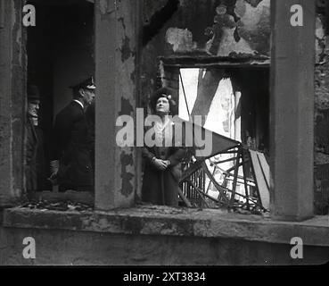 King George VI and Queen Elizabeth Inspecting Bomb Damage, 1942. Britain during the Second World War. From &quot;Time To Remember - The End Of The Beginning&quot;, 1942 (Reel 1); documentary film about events of 1942 and America's entry into the war. Stock Photo