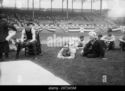 Boxer Joe Welling, amid Cleveland baseball players in stadium, 1918. Shows boxer Joe Welling part of the pre-game entertainment at the Cleveland Indians vs. the New York Yankees game at the Polo Grounds, New York City, May 27, 1918. Stock Photo