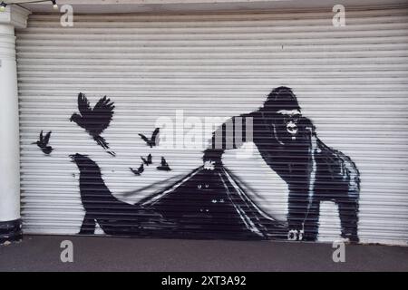 London, UK. 13th Aug, 2024. A new artwork by Banksy has