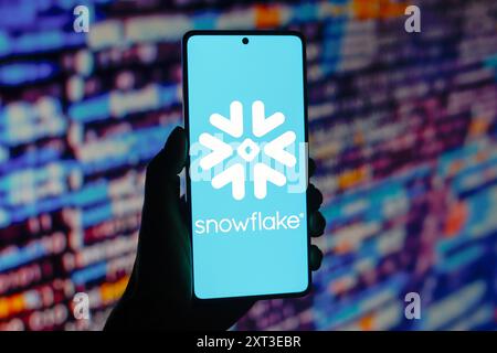 In this photo illustration, the Snowflake Inc. logo is displayed on a smartphone screen. Stock Photo