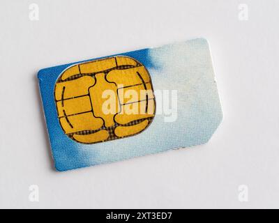 close up of a telecommunications smart phone sim card isolated on a white background Stock Photo