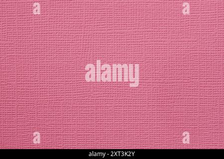 Textured pink paper, woven pattern, soft surface, natural background Stock Photo