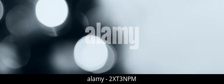 Blurred lights, gray, deep blue background, banner texture. Abstract bokeh with soft light header. Wide screen wallpaper. Panoramic web banner with co Stock Photo