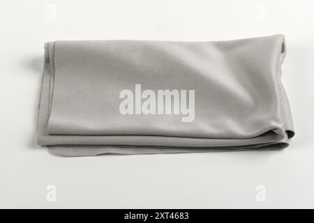 Glass cleaning black cloth napkin, composition isolated on grey background. High resolution photo. Full depth of field. Stock Photo
