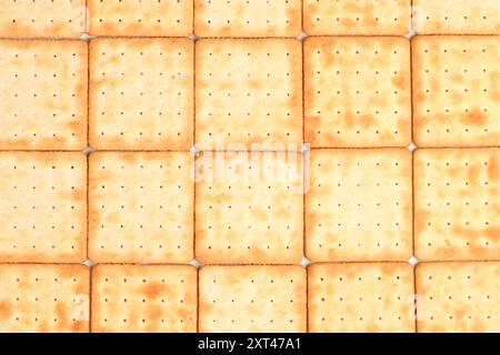Square shortbread cookies background. Stacked butter biscuits for coffee or tee. High resolution photo. Full depth of field. Stock Photo