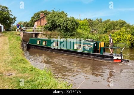 People on canal narrowboats, passing through Hurleston top locks on the Llangollen canal at Hurleston Cheshire England UK Stock Photo