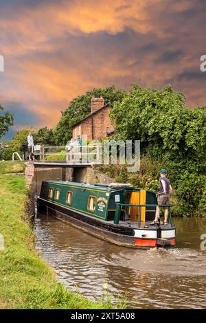 People on canal narrowboats, passing through Hurleston top locks on the Llangollen canal at Hurleston Cheshire England UK Stock Photo