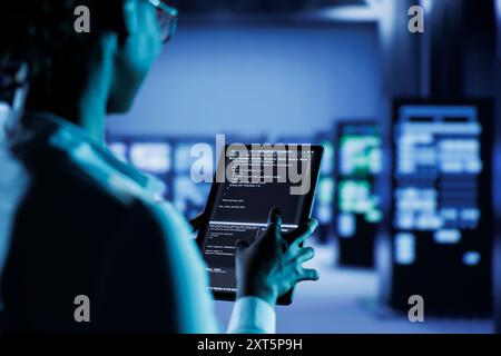 Computer operator builds firewall systems using green screen device in ...