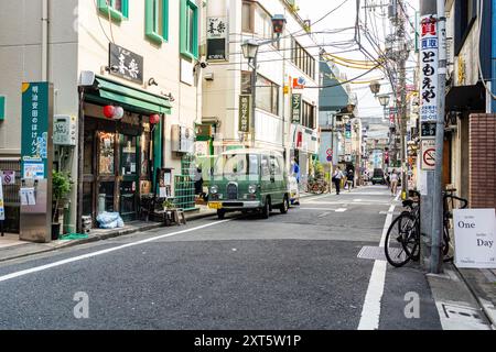 A street of picturesque Shimokitazawa district, in Setagawa ward, with vintage shops and vehicles, in Tokyo, Japan Stock Photo