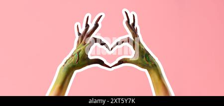 Witch's hands making heart on pink background. Halloween celebration Stock Photo