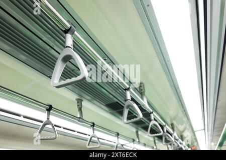 Close-up Subway or Metro Handrail, Hand holding red Handrail in Hong ...
