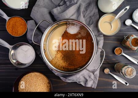 Middle Eastern Breakfast Bake Ingredients in a Pan: Tahini, bulgur, coconut palm sugar, sabaa baharat, cardamom, and sea salt in a small pot Stock Photo