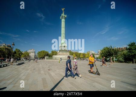 Paris, France - August 10, 2024 : Panoramic view of people walking at the Bastille square and the July column in Paris France Stock Photo