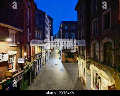 Elevated image looking down Mathew Street in the Cavern Quarter, home of the famous Cavern Club and numerous Beatles themed bars Liverpool UK. Stock Photo