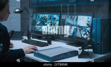 Multiple monitors and big digital screen showing surveillance video footage. Female dispatch or CCTV operator works on computer in monitoring center with security cameras, talks by walkie talkie. Stock Photo