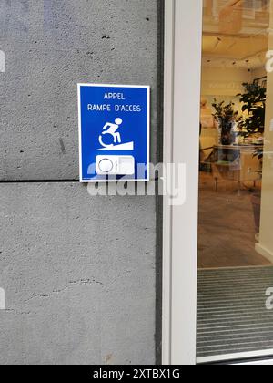Access ramp call button displayed on a building entrance during daylight hours Stock Photo