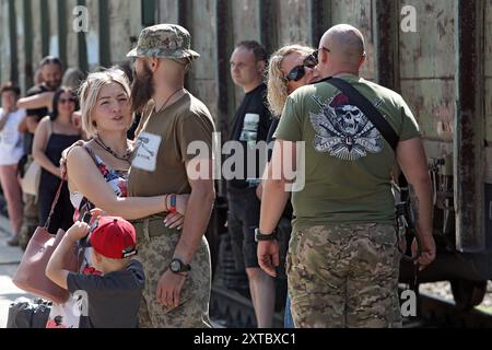 Non Exclusive: KRAMATORSK, UKRAINE - AUGUST 12, 2024 - Ukrainian servicemen say goodbye to their partners on a railway station platform in Kramatorsk, Stock Photo