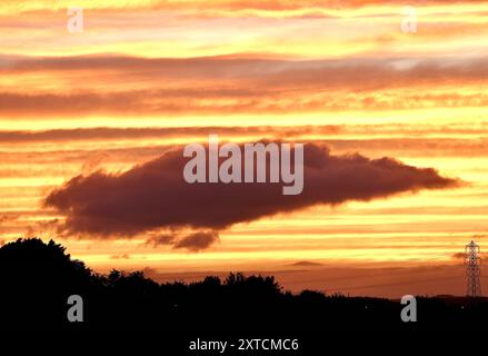 Vivid and dramatic cloud formation during an unusual summer sunset near Annan, Dumfries and Galloway Stock Photo