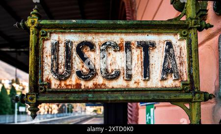 old neoclassical style table with the writing exit in the train station in Lecco in Italy Stock Photo