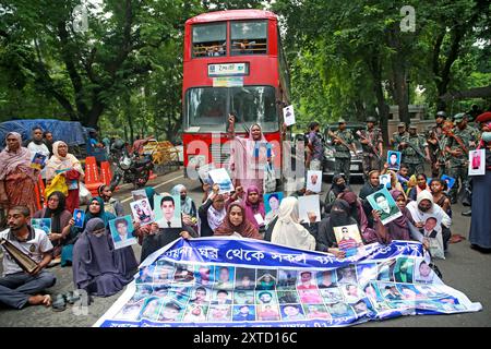 Family members of victims of enforced disappearances holding the photographs of their loved one, along with others, demonstrated in front of the State Stock Photo