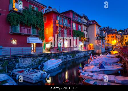 Moored boats in Varenna, small town on lake Como at night, Italy Stock Photo