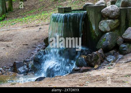 small artificial waterfall on stream in city park. Minsk, Belarus Stock Photo