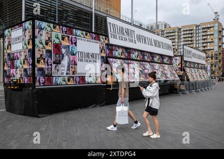 London, UK.  14 August 2024.  Official merchandise ('merch') stands in front of Brent Library outside Wembley Stadium ahead of Taylor Swift’s Eras Tour August concerts.  Taylor Swift performed at Wembley Stadium for three nights in June and will play five more nights commencing 15 August. Credit: Stephen Chung / Alamy Live News Stock Photo