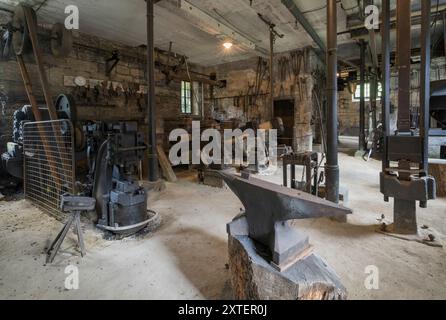 Workshop of a historic hammer mill smithy. Stock Photo
