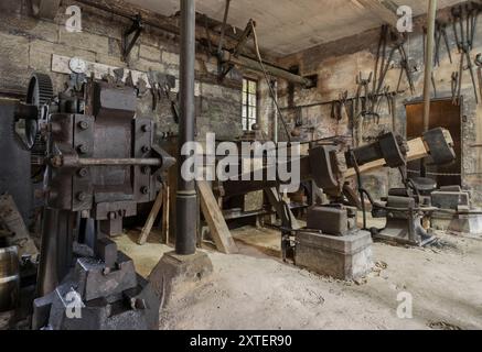 Workshop of a historic hammer mill smithy. Stock Photo