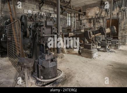 Workshop of a historic hammer mill smithy. Stock Photo