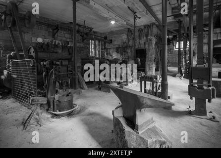 Workshop of a historic hammer mill smithy. Stock Photo