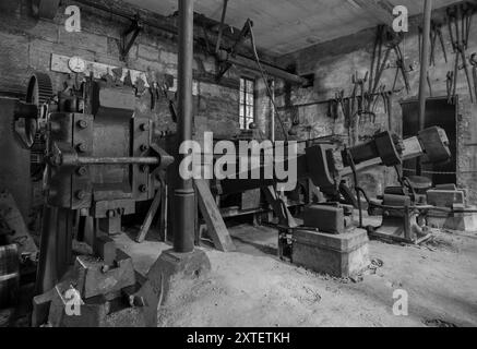 Workshop of a historic hammer mill smithy. Stock Photo