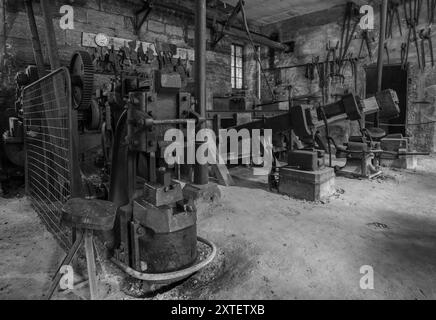 Workshop of a historic hammer mill smithy. Stock Photo