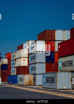 Global Supply Chains - Containers stacked on the dockside at the Port of Felixstowe UK. Global Supply Chain Congestion. Stock Photo