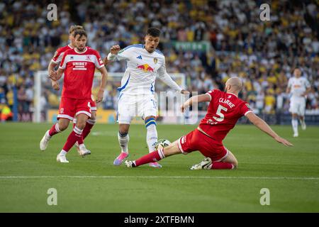 Middlesbrough's Matthew Clarke tackles Leeds United's Joel Piroe during the Carabao Cup match between Leeds United and Middlesbrough at Elland Road, Leeds on Wednesday 14th August 2024. (Photo: Trevor Wilkinson | MI News) Credit: MI News & Sport /Alamy Live News Stock Photo