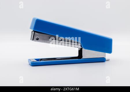 essential object in an office, blue on a white background, stapler Stock Photo