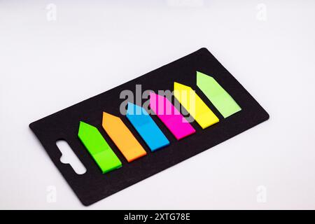 Set of multi-colored self-adhesive markers on white background Stock Photo