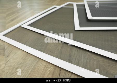 Window Screen Set Designs Set of window screens on wooden floor, closeup Stock Photo - Alamy