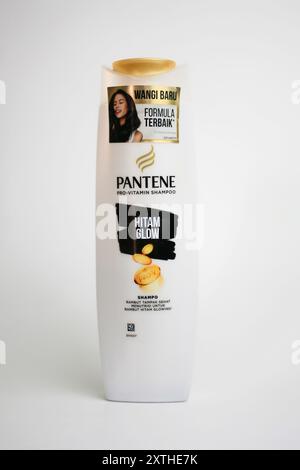 Close up a bottle of Pantene Pro Vitamine Shampoo Black Glow isolated on white background. Front View. Stock Photo