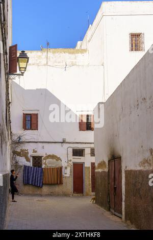 Casablanca, Morocco - March 29, 2023: View of a typical alley, with a local, in the Old Medina of Casablanca, Morocco Stock Photo