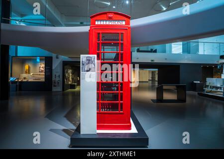 London Science Museum interior with a red phone booth often called a red telephone box in London. Inside Science Museum scientific exhibits, displays. Stock Photo