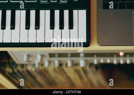 Vintage retro sound equipment. Piano keyboard amplifier and vinyl record Stock Photo