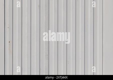 Old white painted corrugated galvanized iron. Backgrounds and textures. Stock Photo
