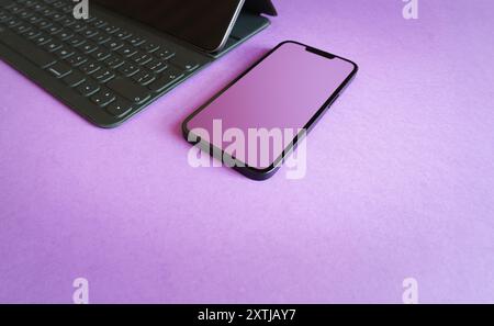 Smart phone clean screen mockup. Purple background Stock Photo