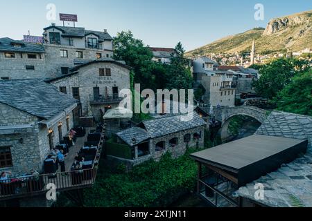 MOSTAR, BOSNIA AND HERZEGOVINA - May 18, 2024: View of the Crooked Bridge. High quality photo Stock Photo