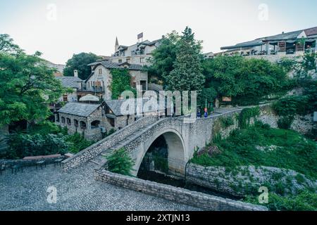 MOSTAR, BOSNIA AND HERZEGOVINA - May 18, 2024: View of the Crooked Bridge. High quality photo Stock Photo