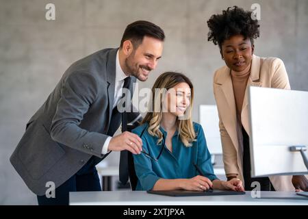 Group of diverse multiethnic business people and software developers working as a team in office Stock Photo
