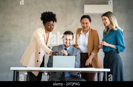 Multicultural professional businesspeople working together on research plan in boardroom. Stock Photo